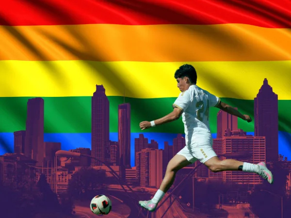 Rainbow flags and soccer supporters at an Atlanta United match