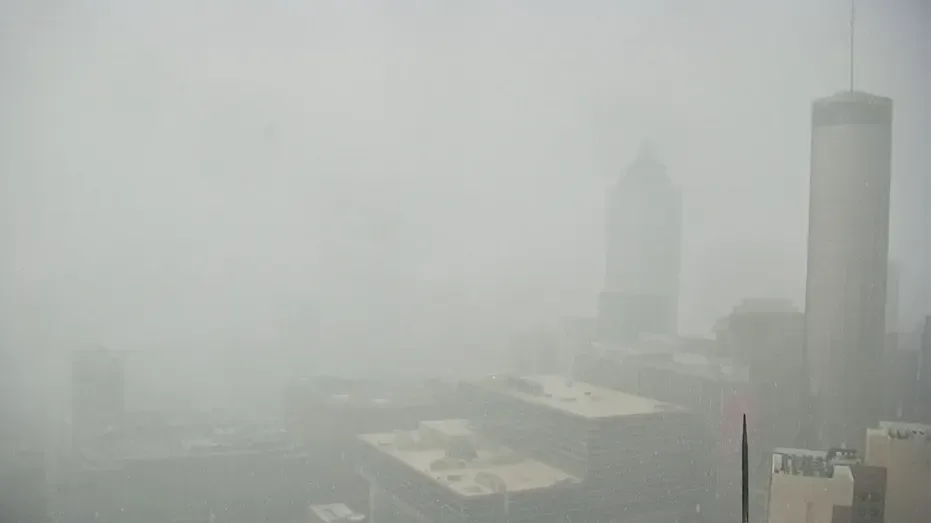 Heavy rain flooding Atlanta streets during flash flood warning