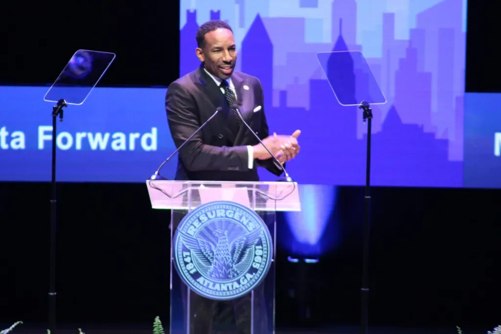 Mayor Andre Dickens speaking at podium during State of the City address