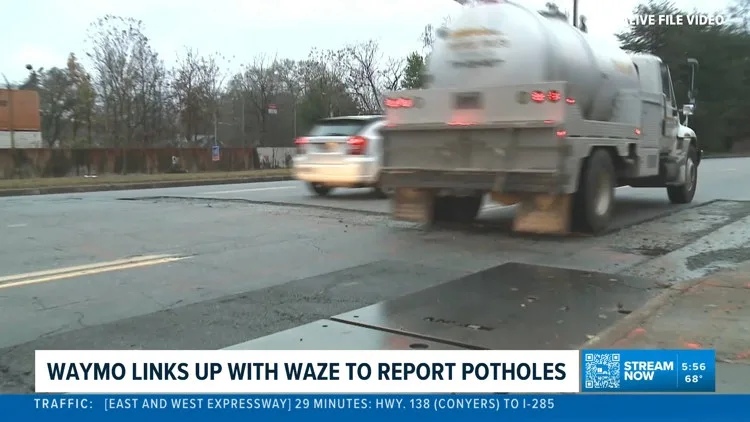A Waymo autonomous vehicle driving on an Atlanta street