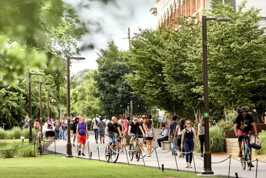 Walkers and cyclists on the Atlanta BeltLine Eastside Trail in spring