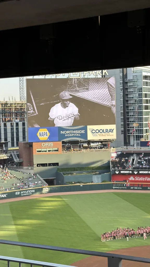 Ozzie Albies celebrates after his home run on Jackie Robinson Day at Truist Park