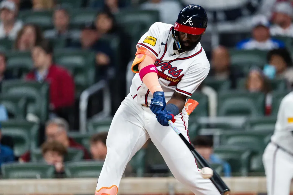 Atlanta Braves players celebrating win over Athletics at Truist Park