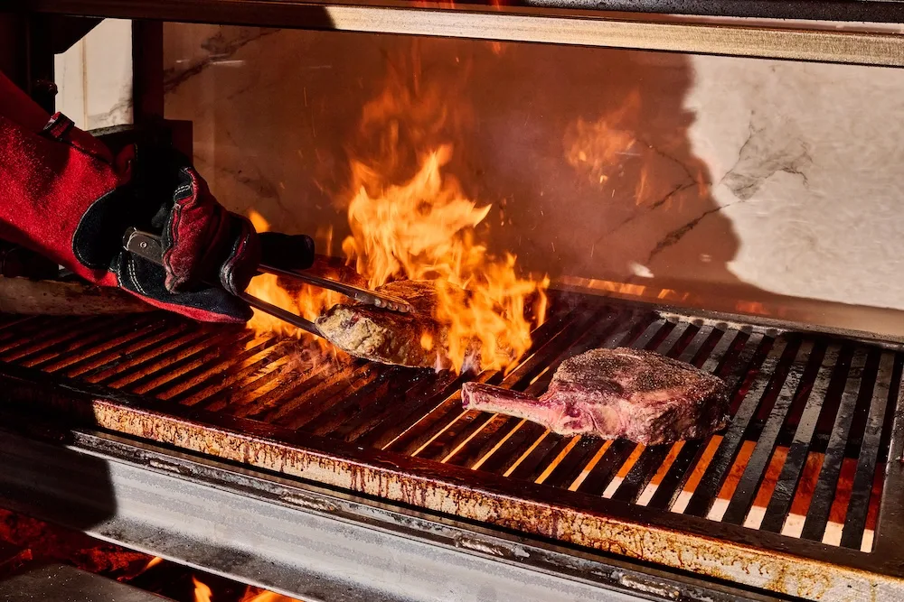 Steak on the grill at Clark's Steakhouse in Buckhead