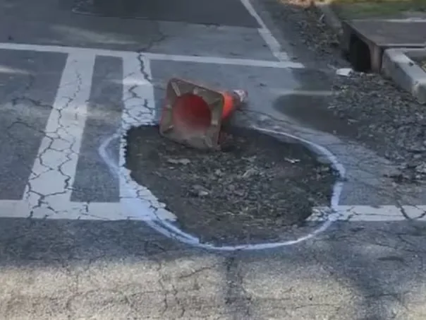 Road crews repair downtown Atlanta pavement ahead of the World Cup