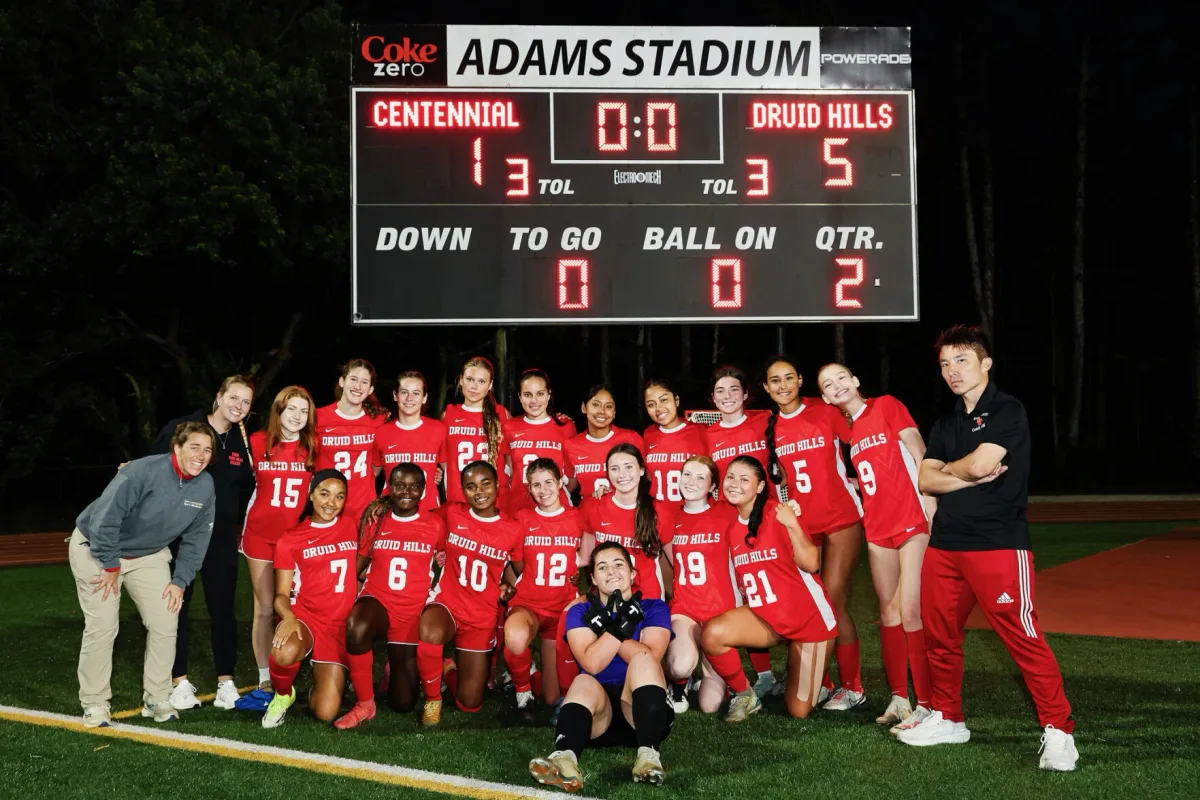 Druid Hills High School girls soccer team celebrating state tournament victory