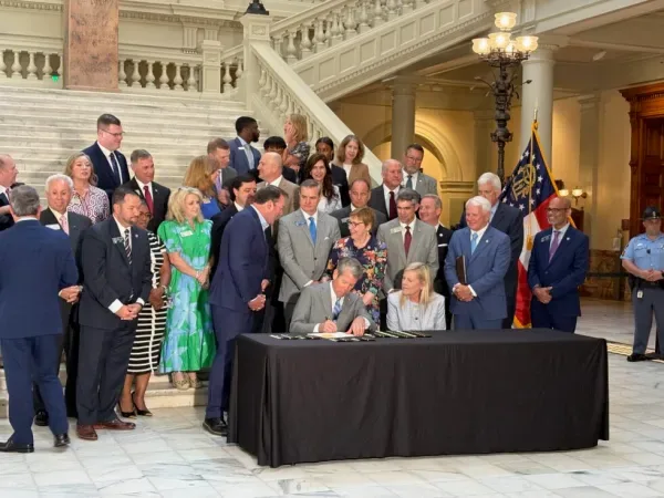 Gov. Brian Kemp signs Georgia tax legislation at the state Capitol