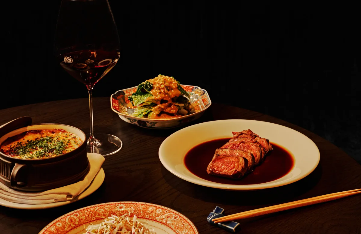 Dishes at Koshu Club in Buckhead including wagyu and yamitsuki cabbage