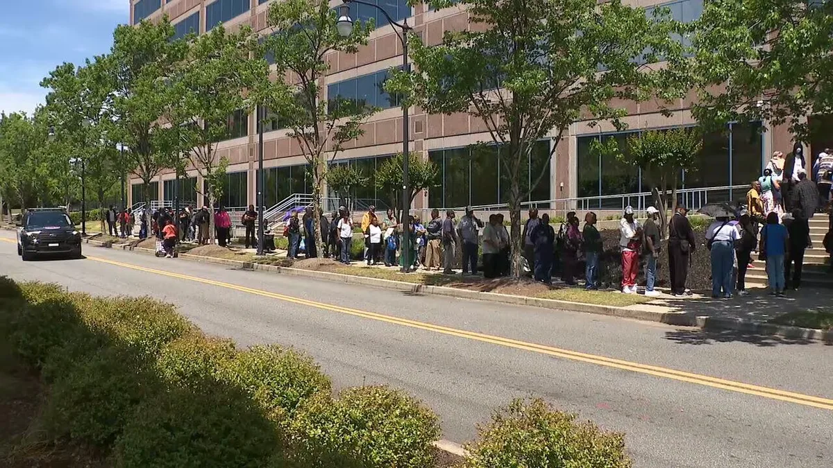 MARTA riders waiting in line for new Breeze cards outside the agency's Lindbergh Station headquarters