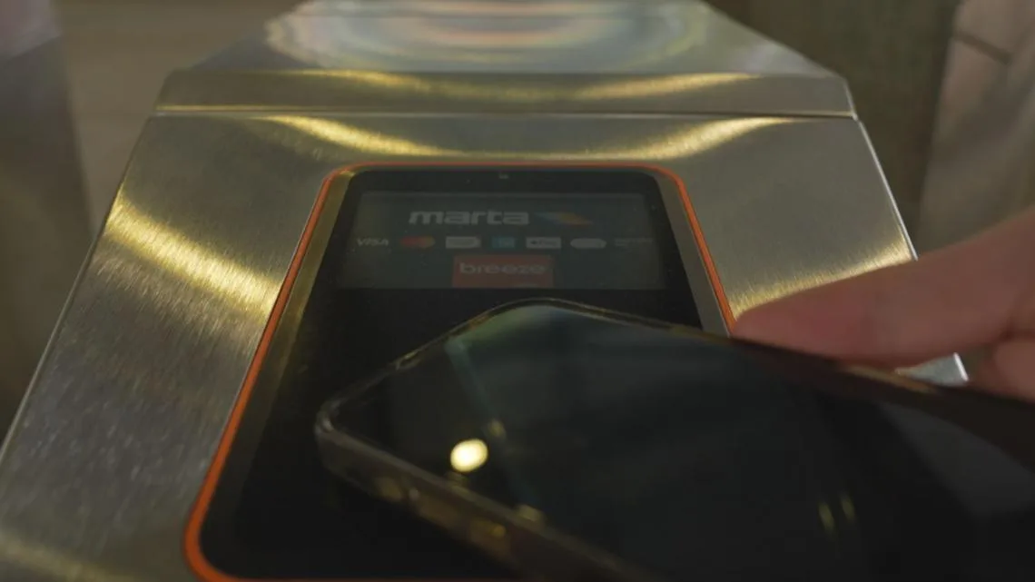 MARTA Better Breeze fare gate at a rail station with tap-to-pay readers