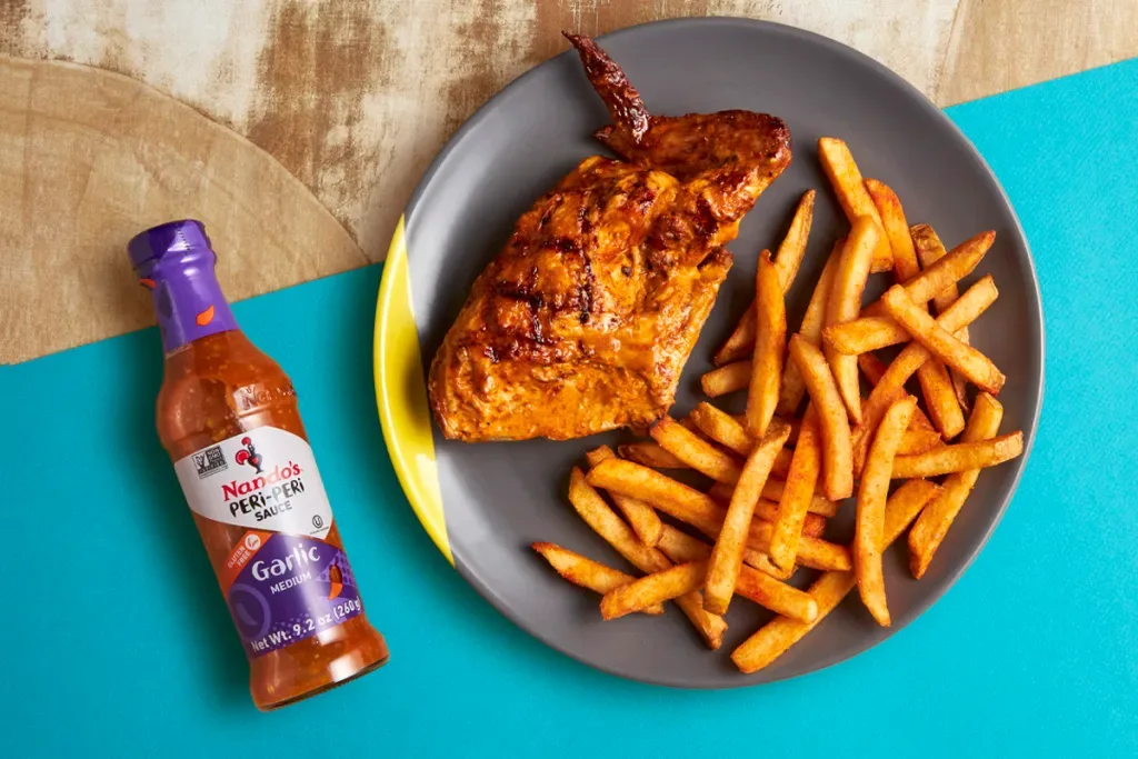 Nando's peri-peri chicken plated for service