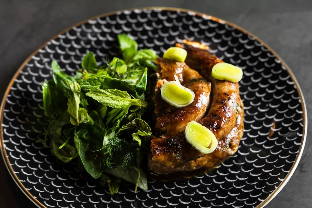Lamb sausage with burnt leeks from O-nada, a new Argentine steakhouse in Atlanta